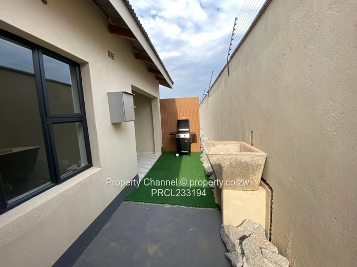 Modern 1-Bed Flat in Pomona, Harare North — Borehole